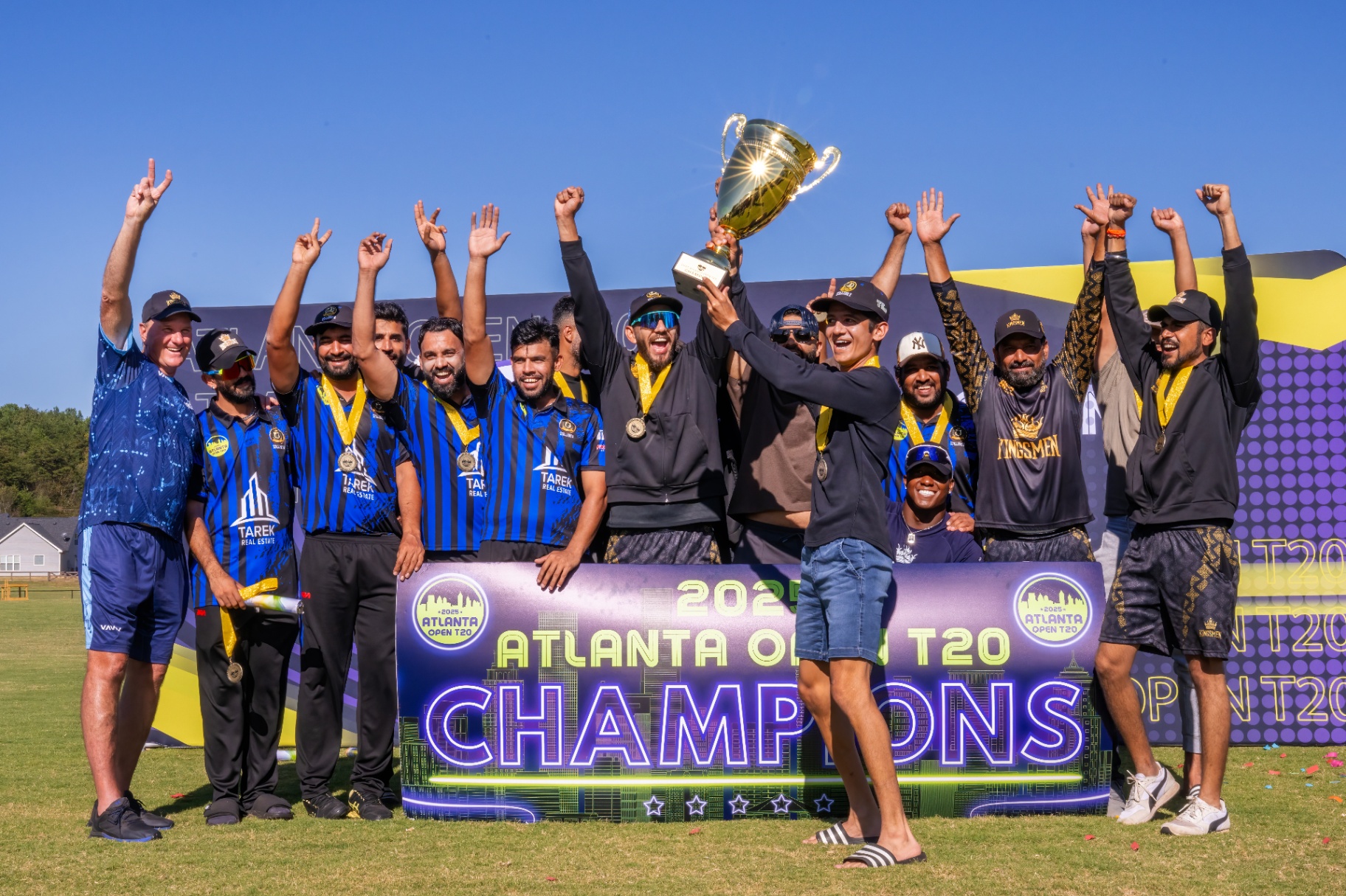 Cricket team lifting the championship trophy